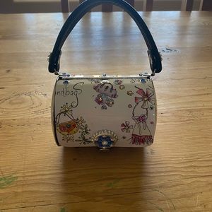 4 small Littlearth purses embellished with Swarovski crystals